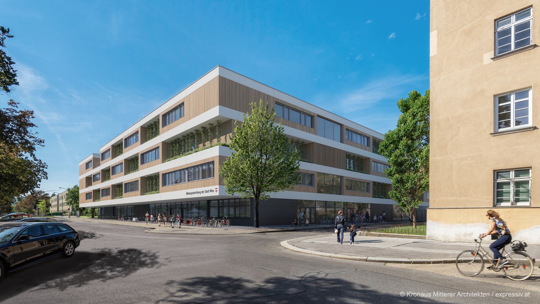 Zu sehen ist der Bildungsstandort Hinaysgasse von außen, ein moderner Bau mit Holzelementen und Wandbegrünung.